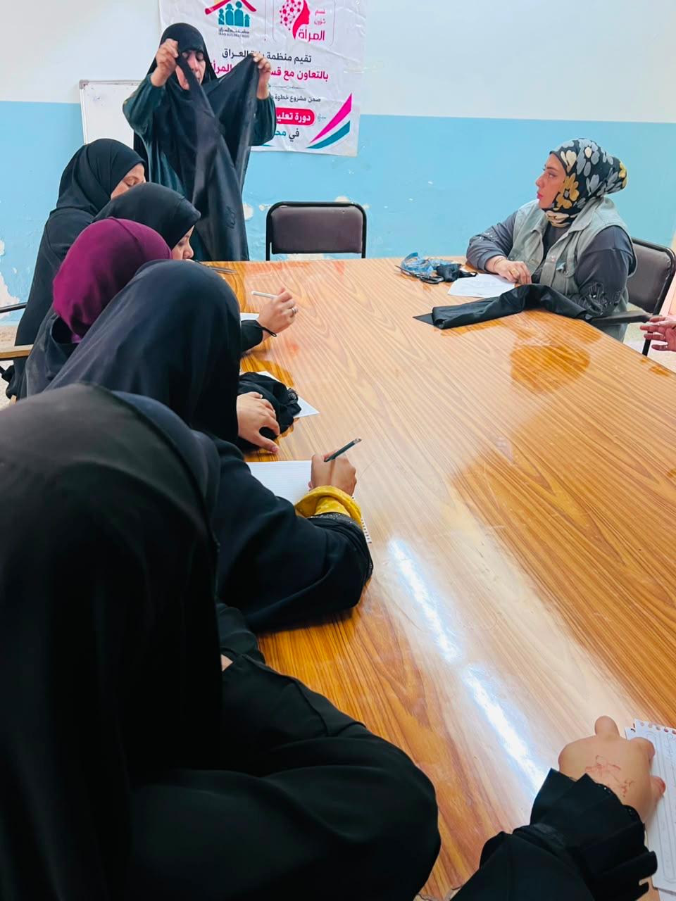 Sewing course in Al-Warka — a trainee shows her work